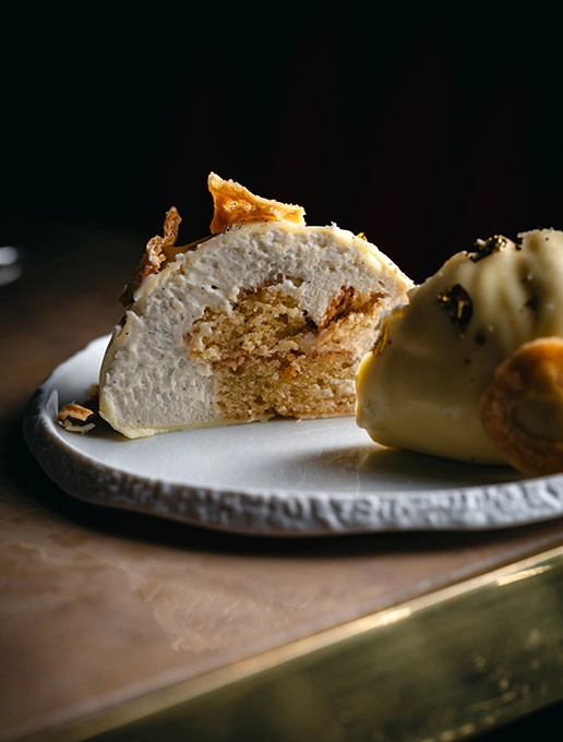 A refined dessert, split open to reveal its delicious texture, served at Dans le Noir ?