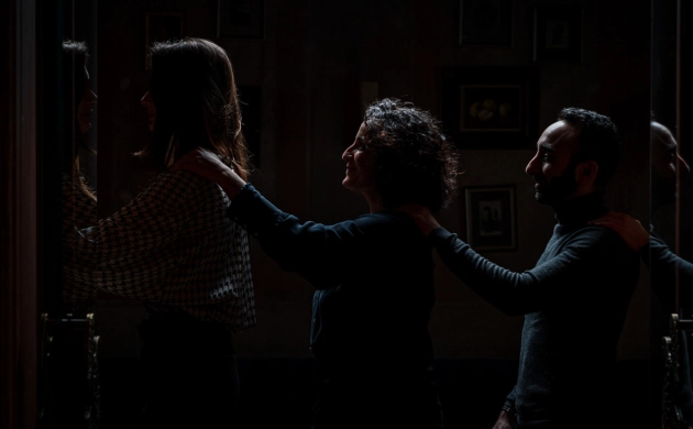 Unusual teambuilding activity in London: colleagues entering a dark restaurant for a sensory and bonding experience.